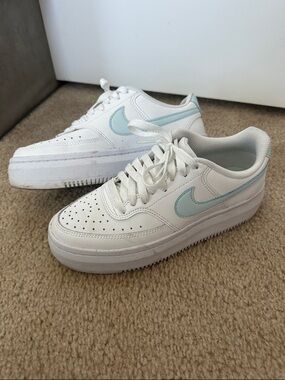 Nike Women’s White Sneakers with Light Blue Swoosh